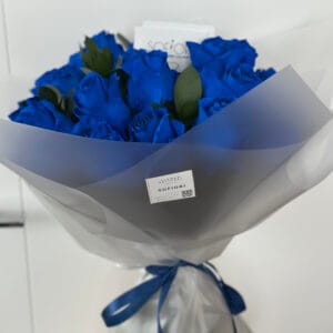 Elegant Blue Rose Bouquet: A stunning bouquet of 25 vibrant blue roses, expertly arranged and wrapped in soft gray paper with a blue ribbon.